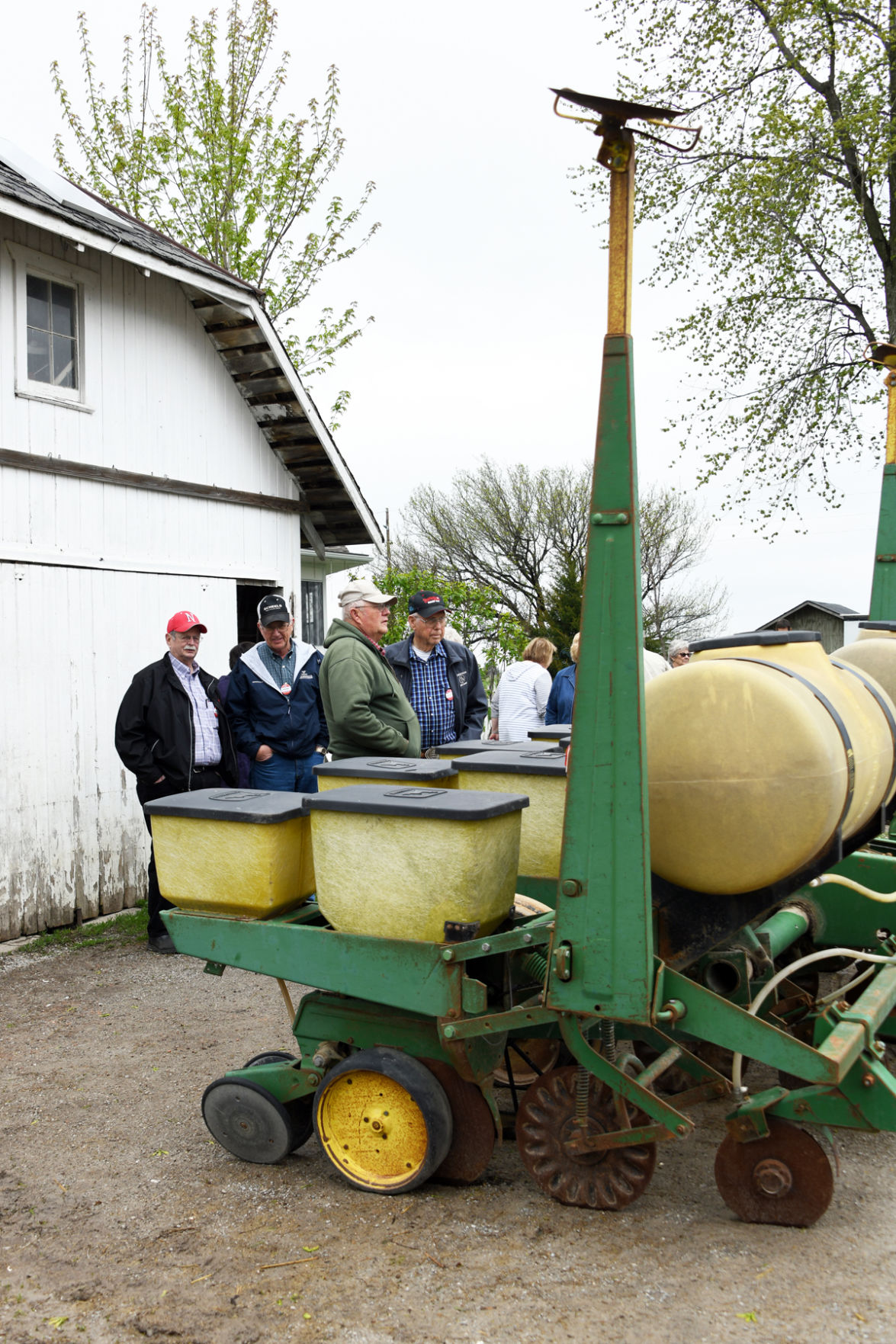 121 Alan Larson, Dale Epp, Curt Folkerts, Arvid Janzen discuss the liberal Amish farmer's equipment.JPG